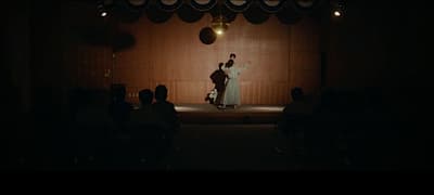 a couple of people that are standing on a stage