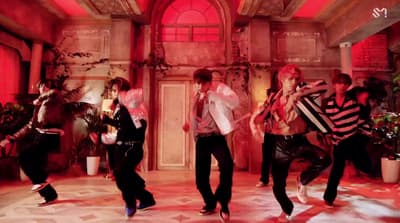 a group of people dancing in a room