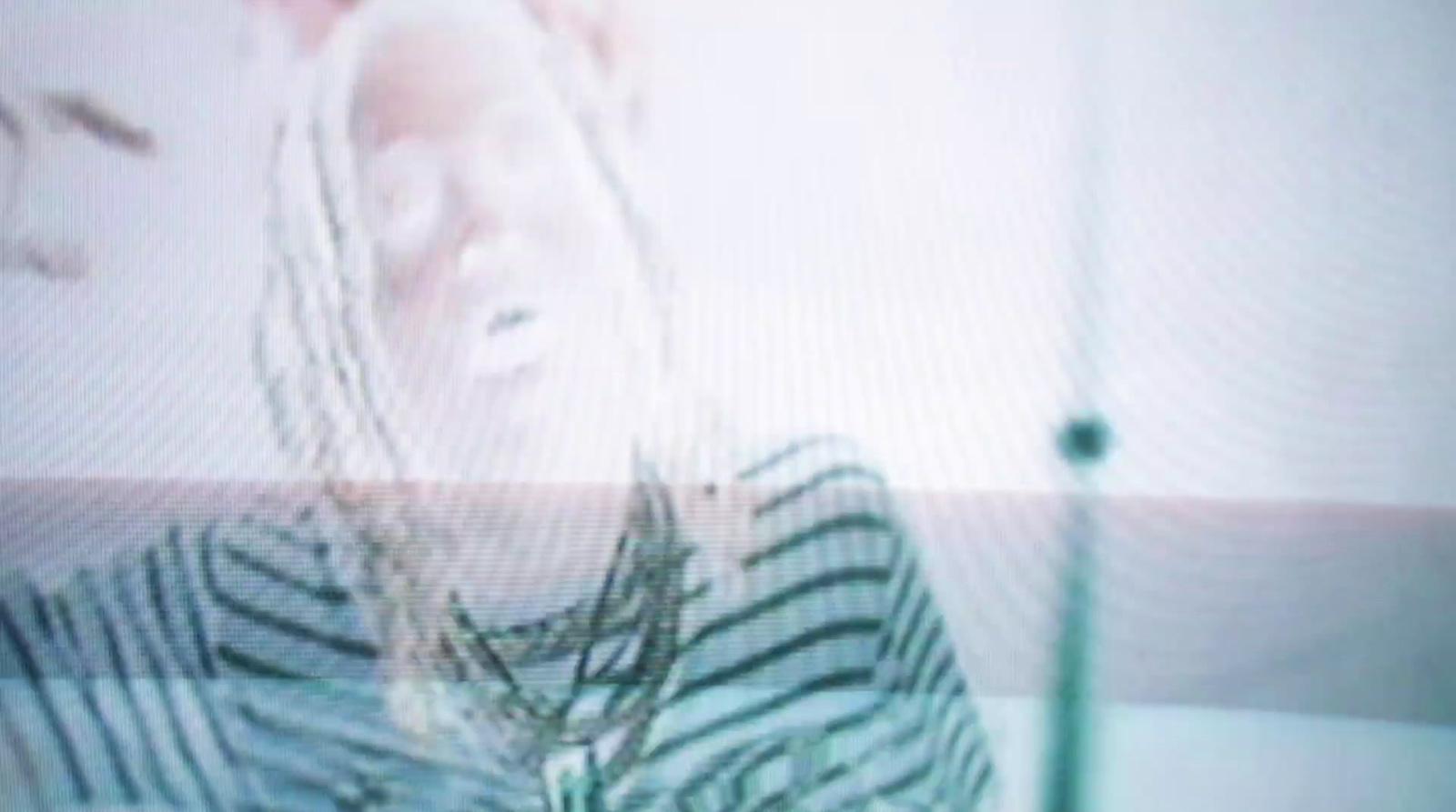 a blurry photo of a woman with a cell phone