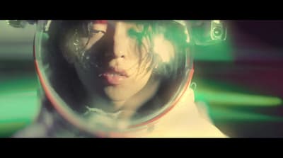 a woman wearing a space suit and a helmet