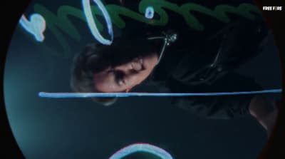 a person with headphones on in a dark room