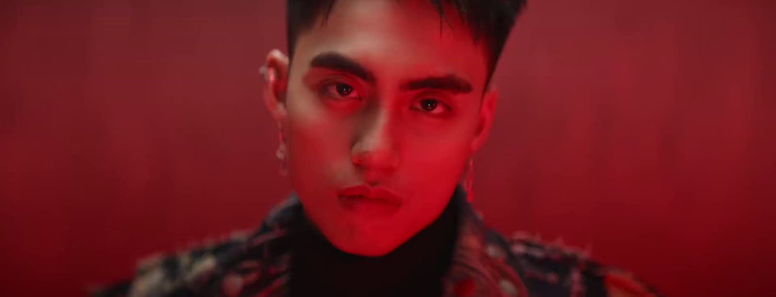 a man with a red light on his face
