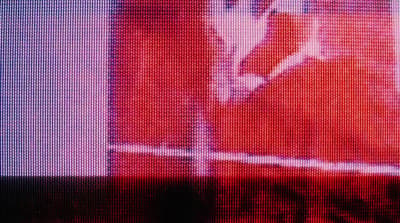 a blurry picture of a person holding a tennis racket
