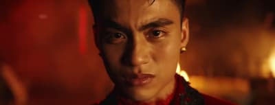 a close up of a person wearing a red shirt