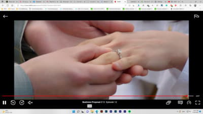 a man and a woman holding hands with a ring on their fingers
