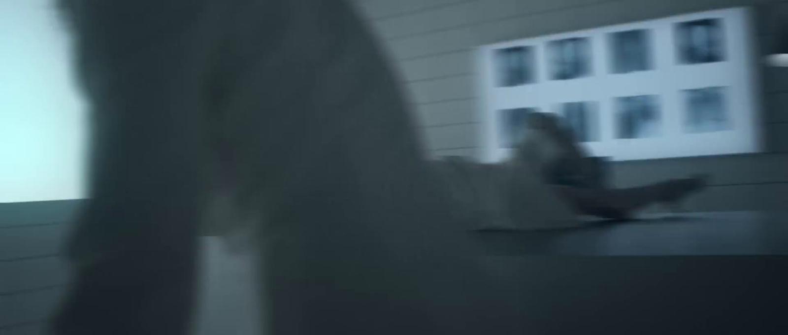 a blurry photo of a person sitting at a table