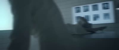 a blurry photo of a person sitting at a table