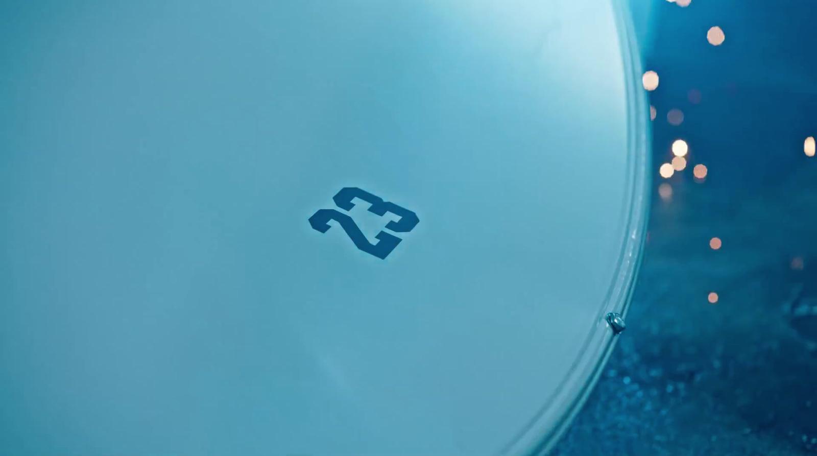 a close up of a white object with a blue background