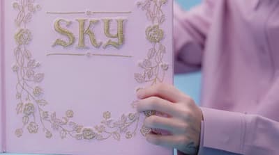 a close up of a person holding a cake