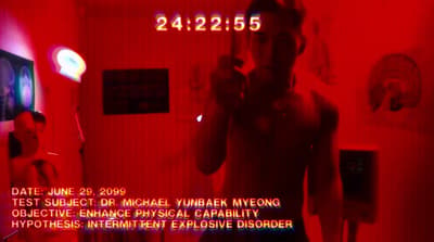 a woman standing in a room with a red light