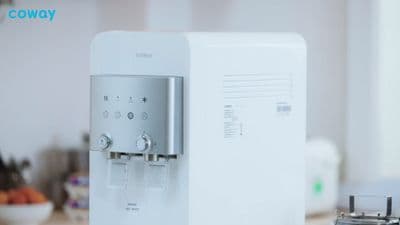 a water dispenser sitting on top of a counter