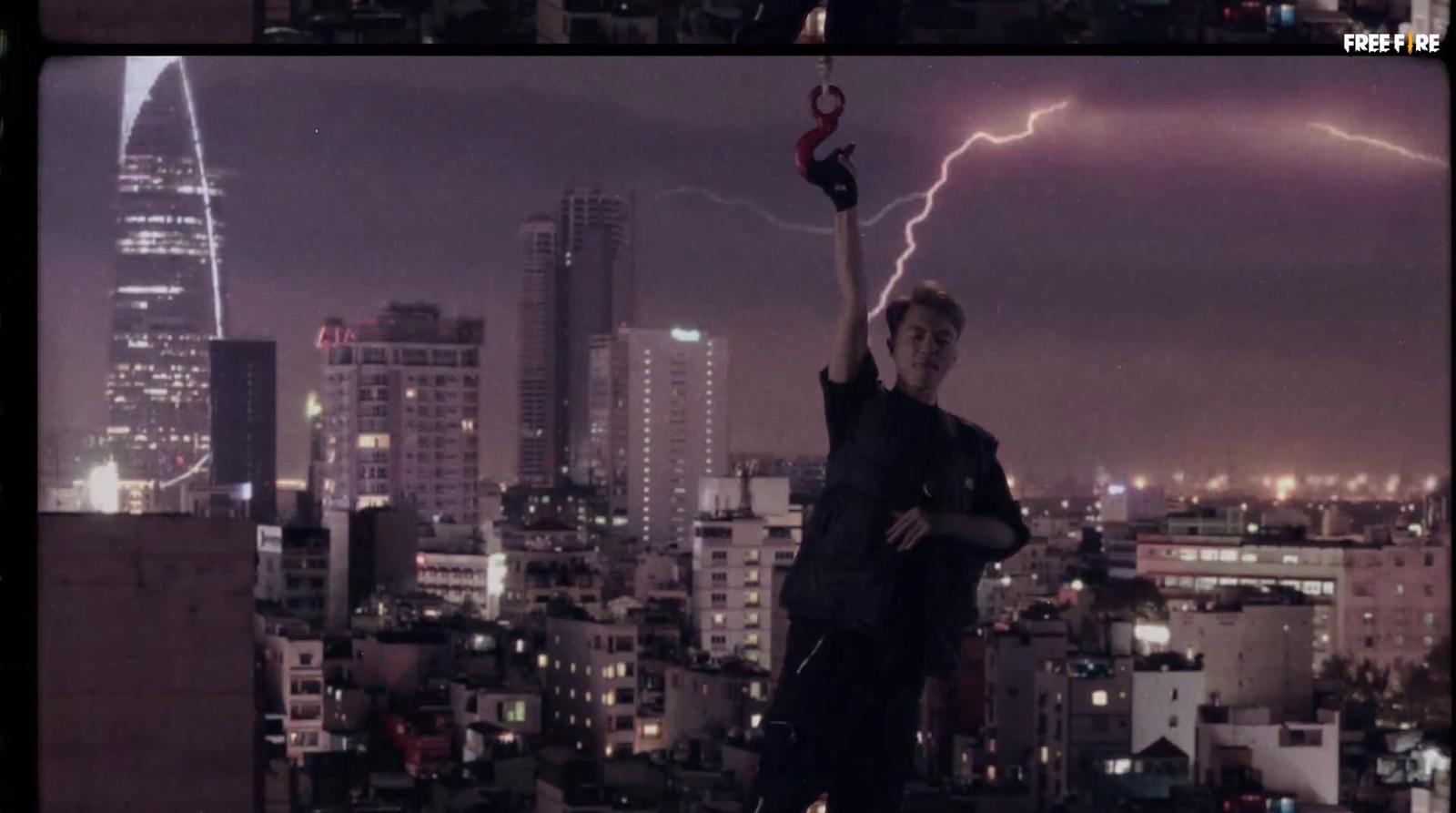 a man standing on top of a building holding a lightning bolt