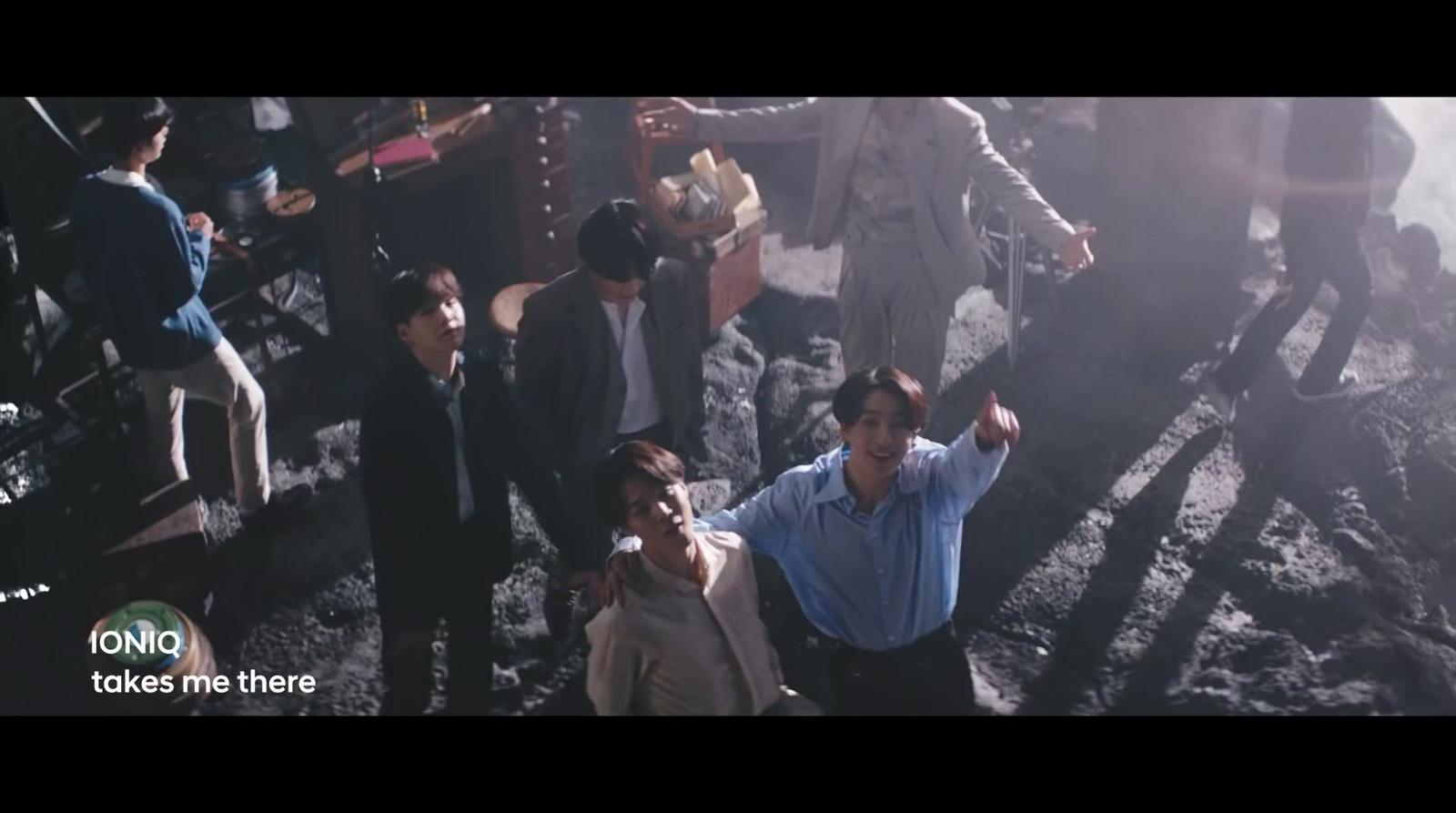 a group of people standing around each other