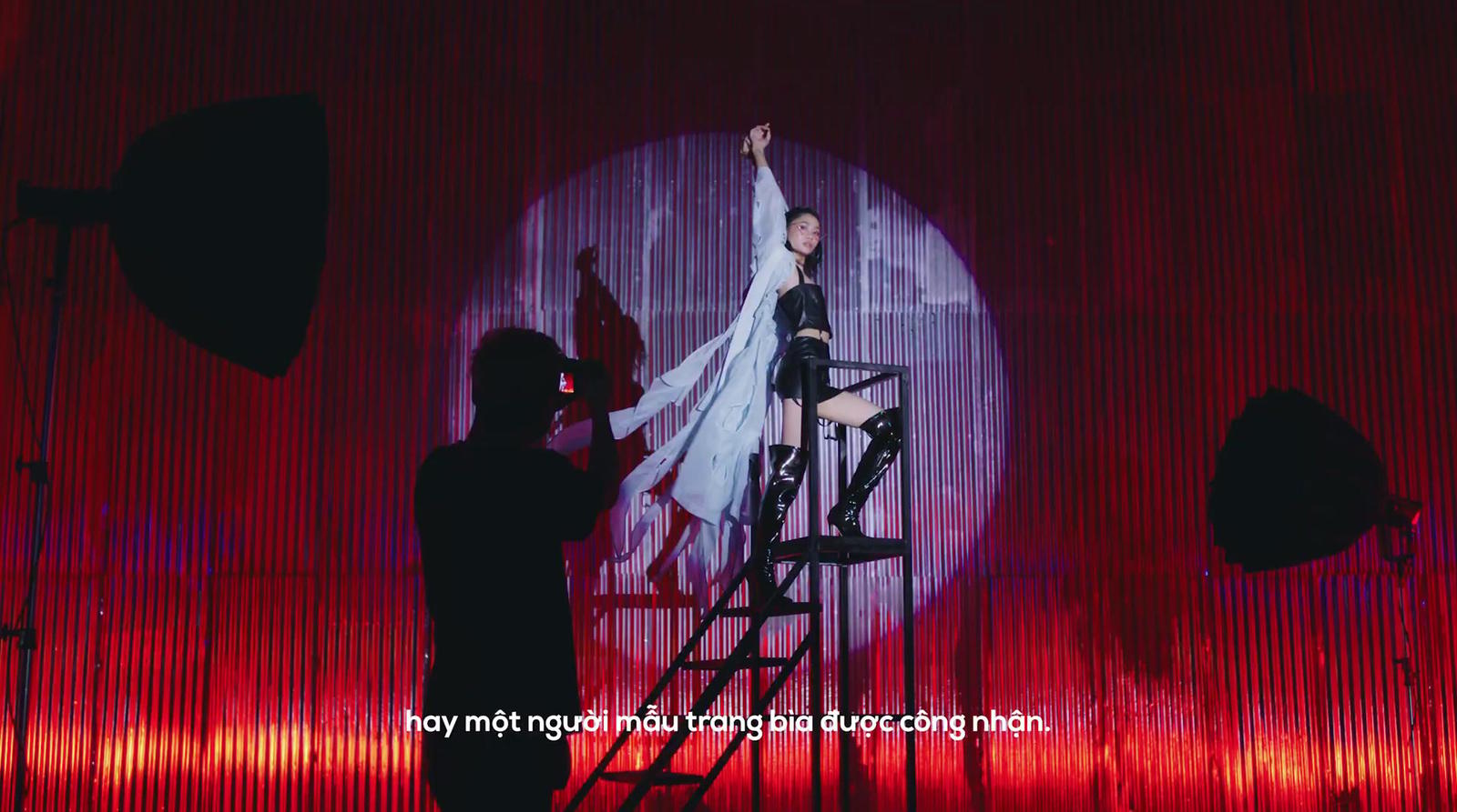 a woman standing on a stage with a microphone