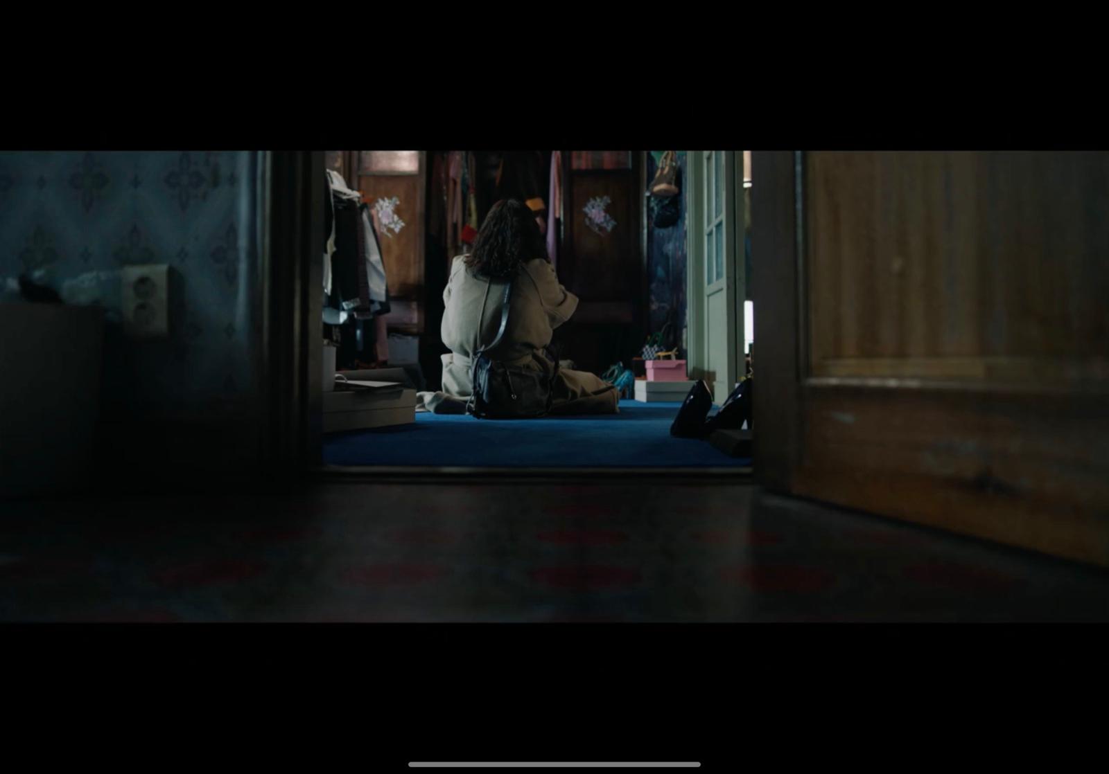 a person sitting on the floor in a room