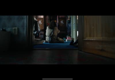 a person sitting on the floor in a room