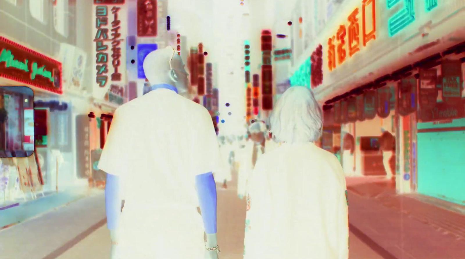 a couple of people that are standing in the street
