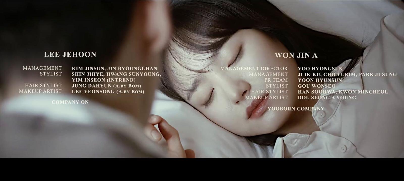 a woman sleeping in bed with her eyes closed