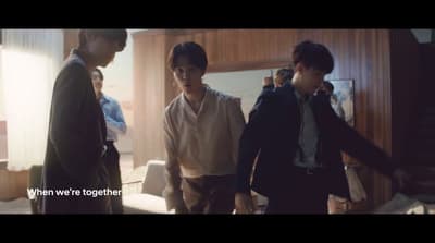 a group of young men standing next to each other