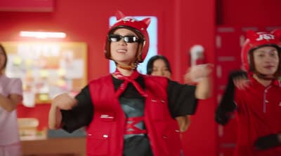 a group of people wearing red and black clothing