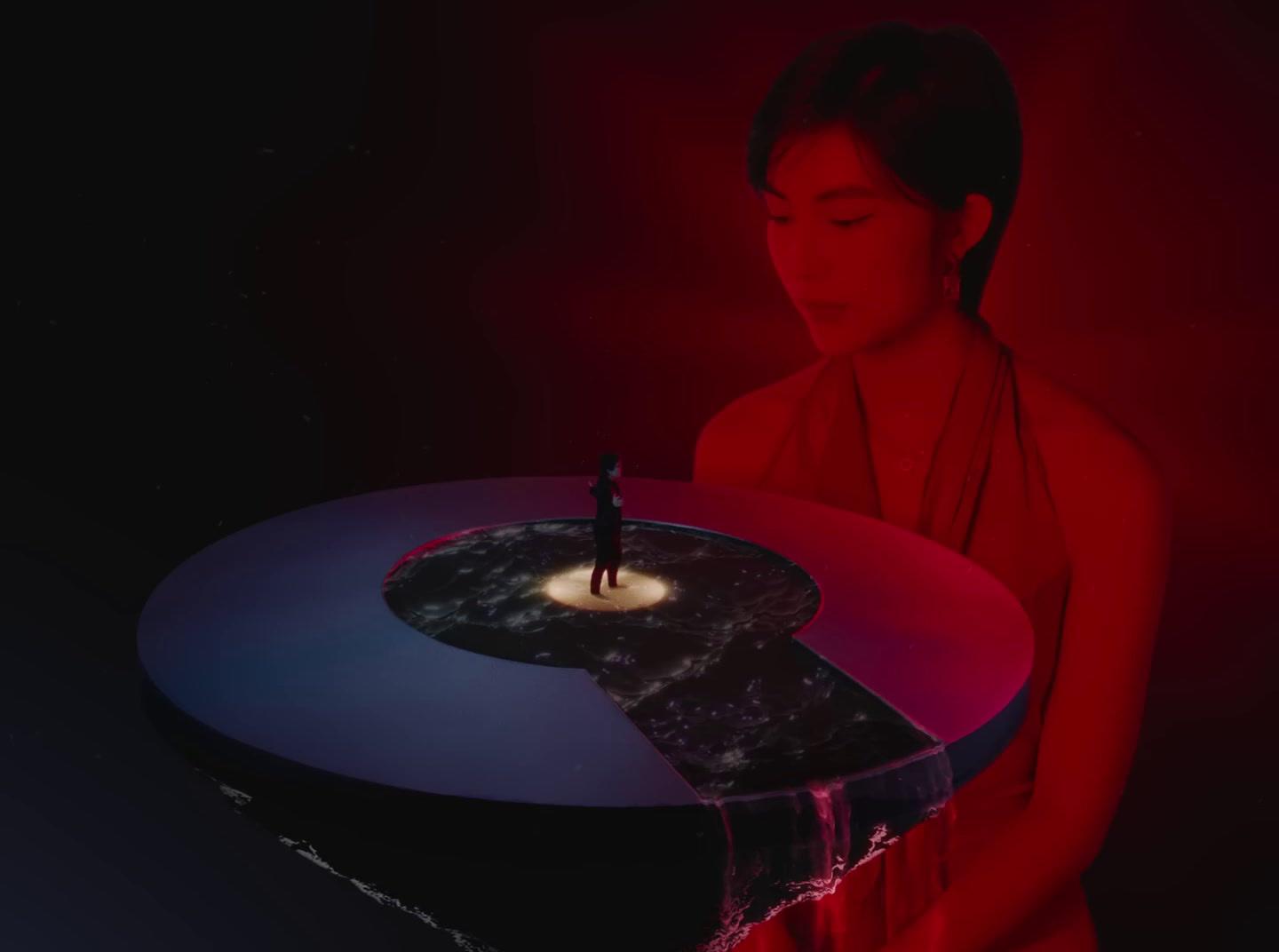 a woman standing in front of a table with a candle on it
