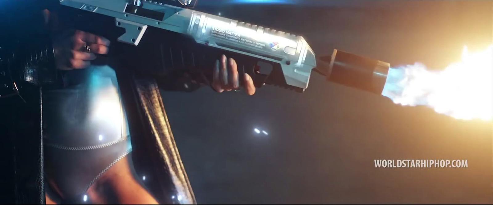 a man holding a gun in his right hand