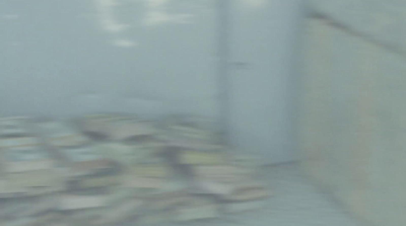 a blurry image of a bed in a room