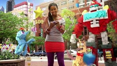 a woman standing in front of a lego sculpture