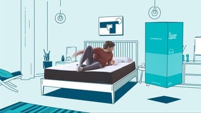a man laying on top of a bed in a room