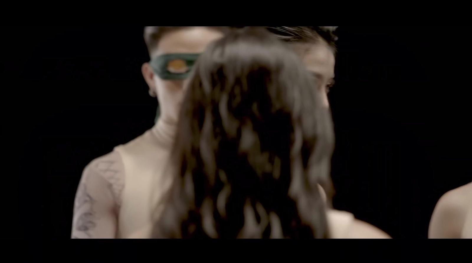 a man with a mask on his face and a woman with a mask on her