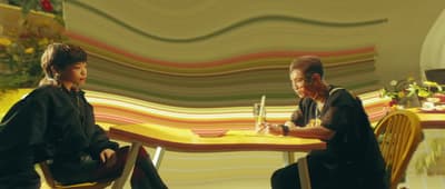 a couple of people sitting at a table