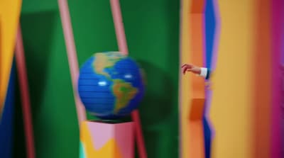 a colorful room with a globe on a pole
