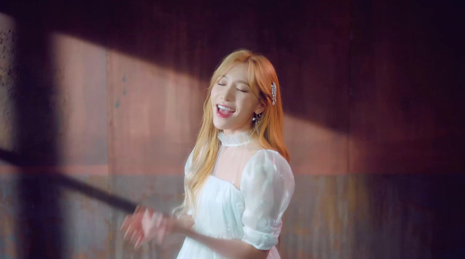 a woman in a white dress is smiling