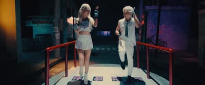 a couple of people that are standing on skateboards