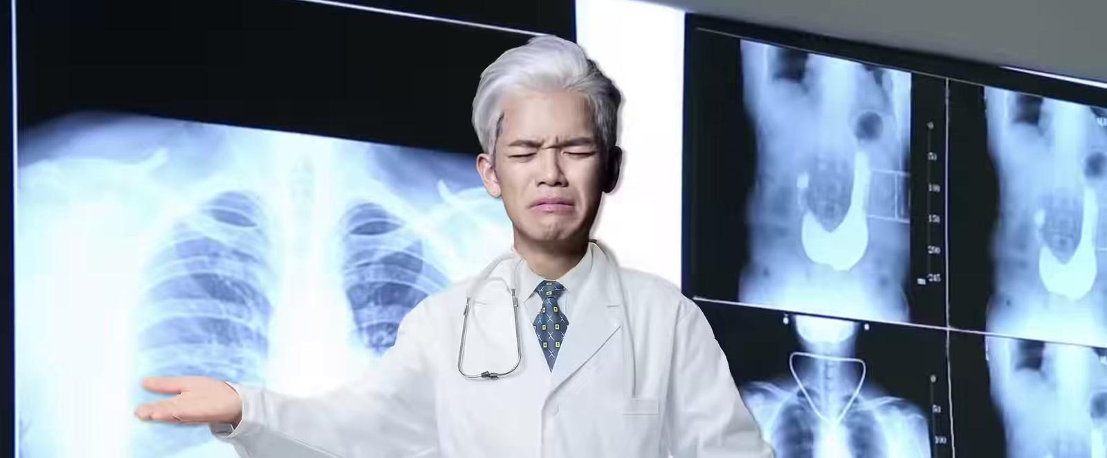 a man in a white lab coat standing in front of an x - ray