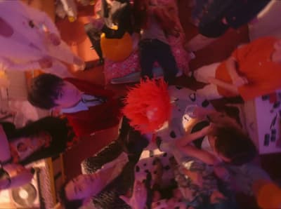 a group of people standing around each other