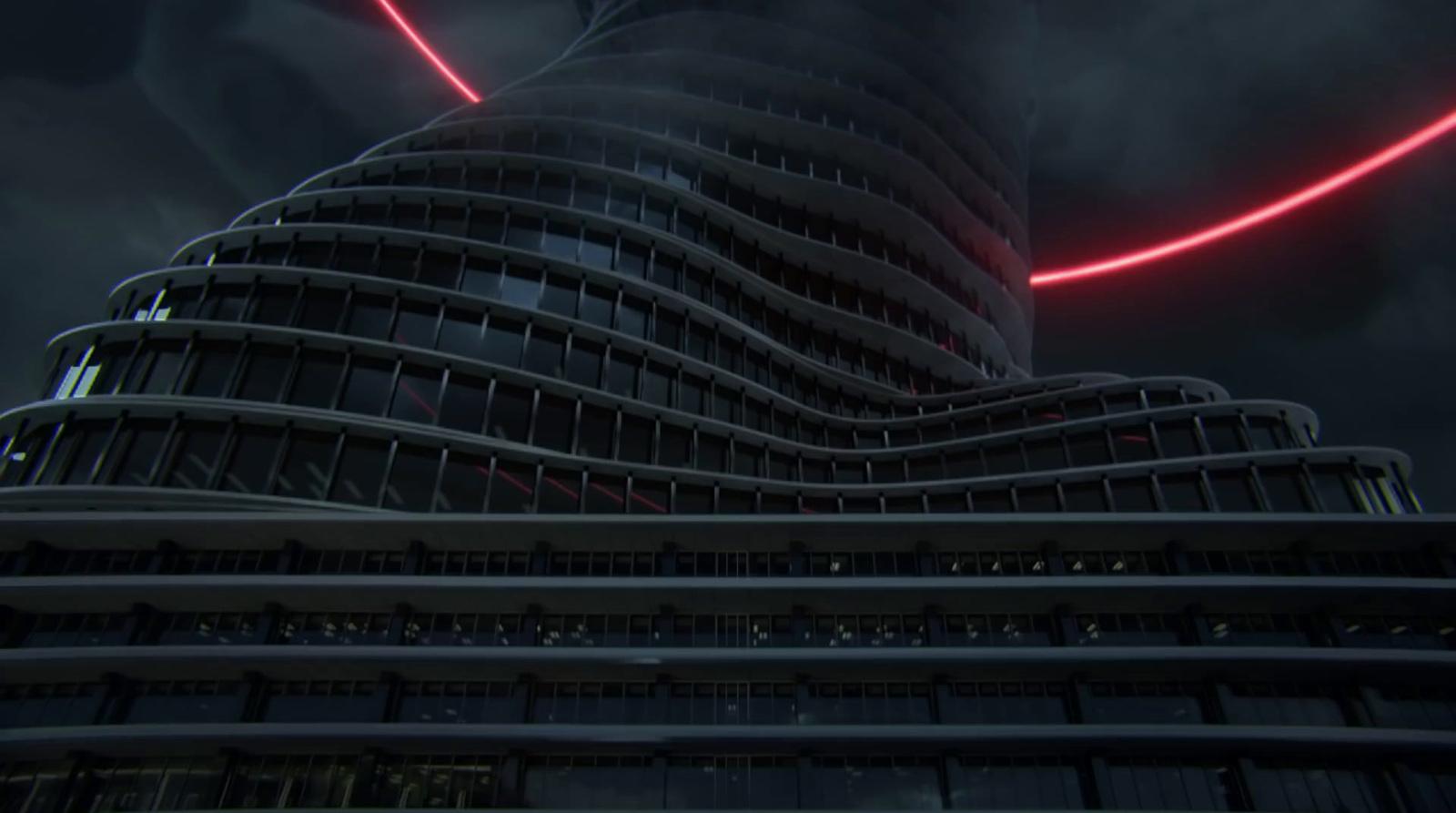 a very tall building with a red light on it's side