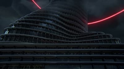 a very tall building with a red light on it's side