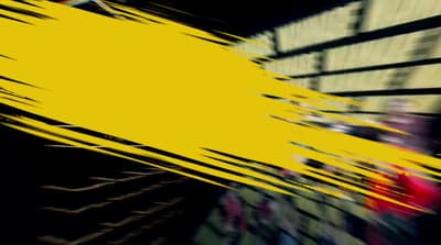a blurry image of a yellow object in the air