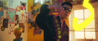 a man wearing sunglasses and a black jacket