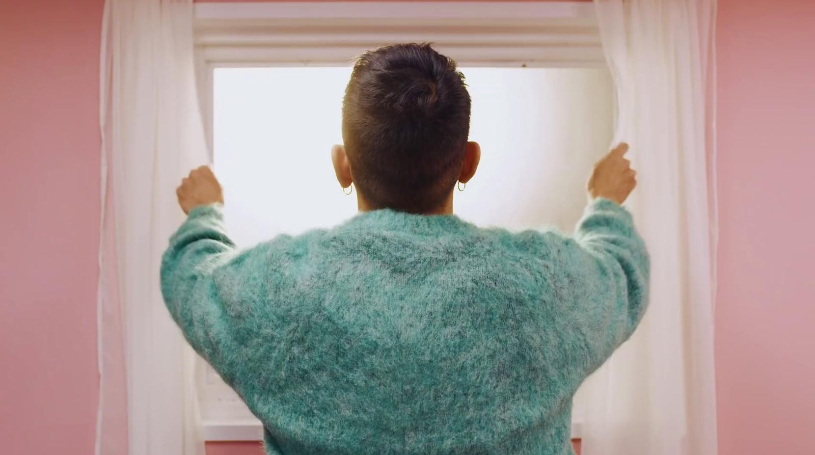 a person standing in front of a window