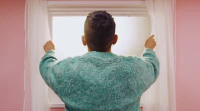 a person standing in front of a window