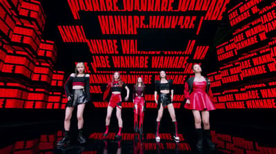 a group of women standing next to each other on a stage