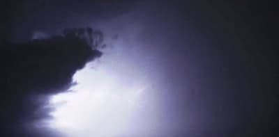 a large cloud with a lightning bolt coming out of it