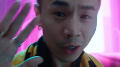 a man making a weird face with his hand