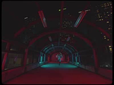 a person standing in a tunnel at night