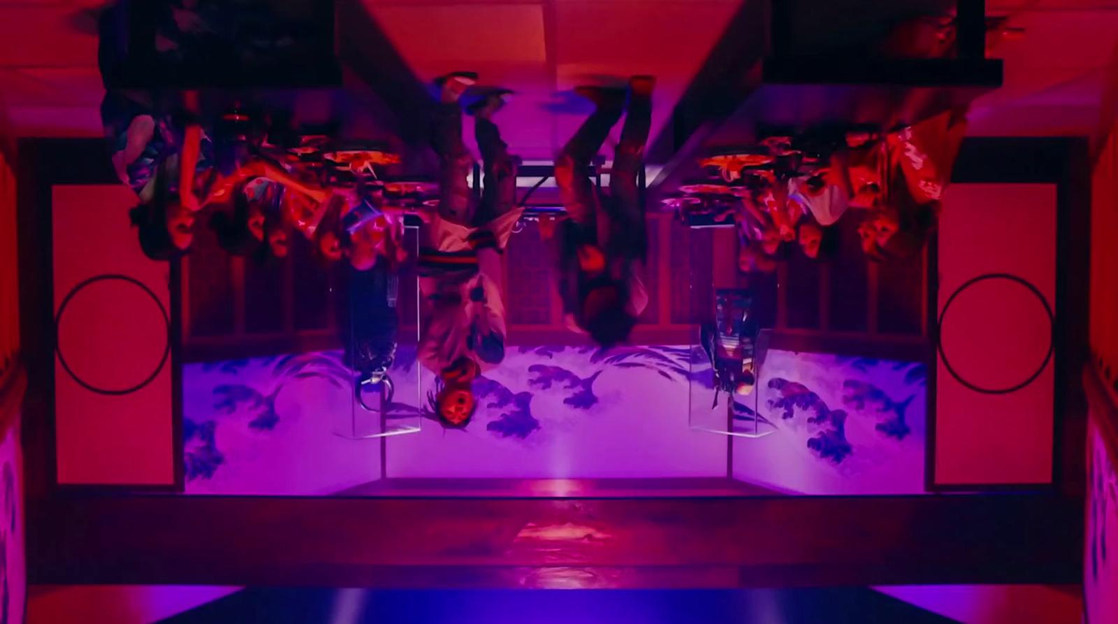 a room filled with lots of purple and red lights