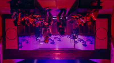 a room filled with lots of purple and red lights
