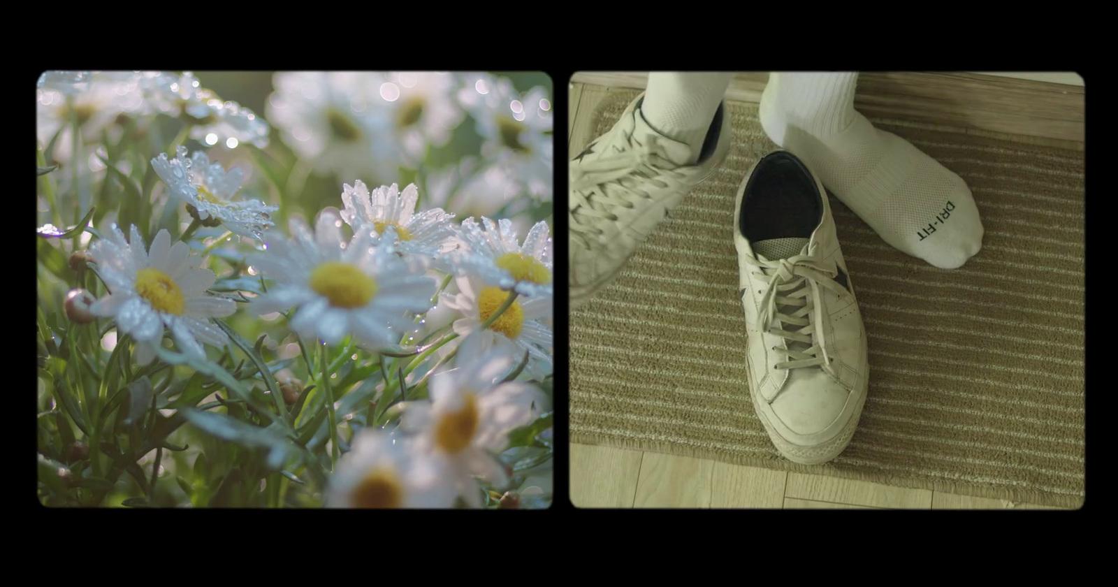 a pair of white shoes sitting on top of a rug