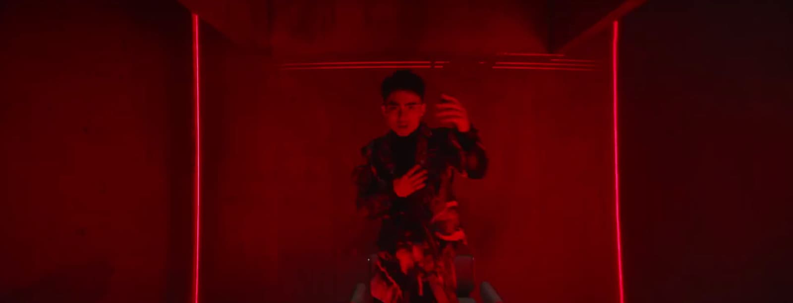 a man taking a picture of himself in a red room